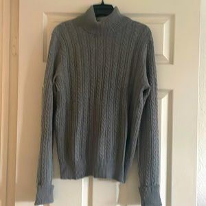 Lightweight, grey turtleneck sweater.